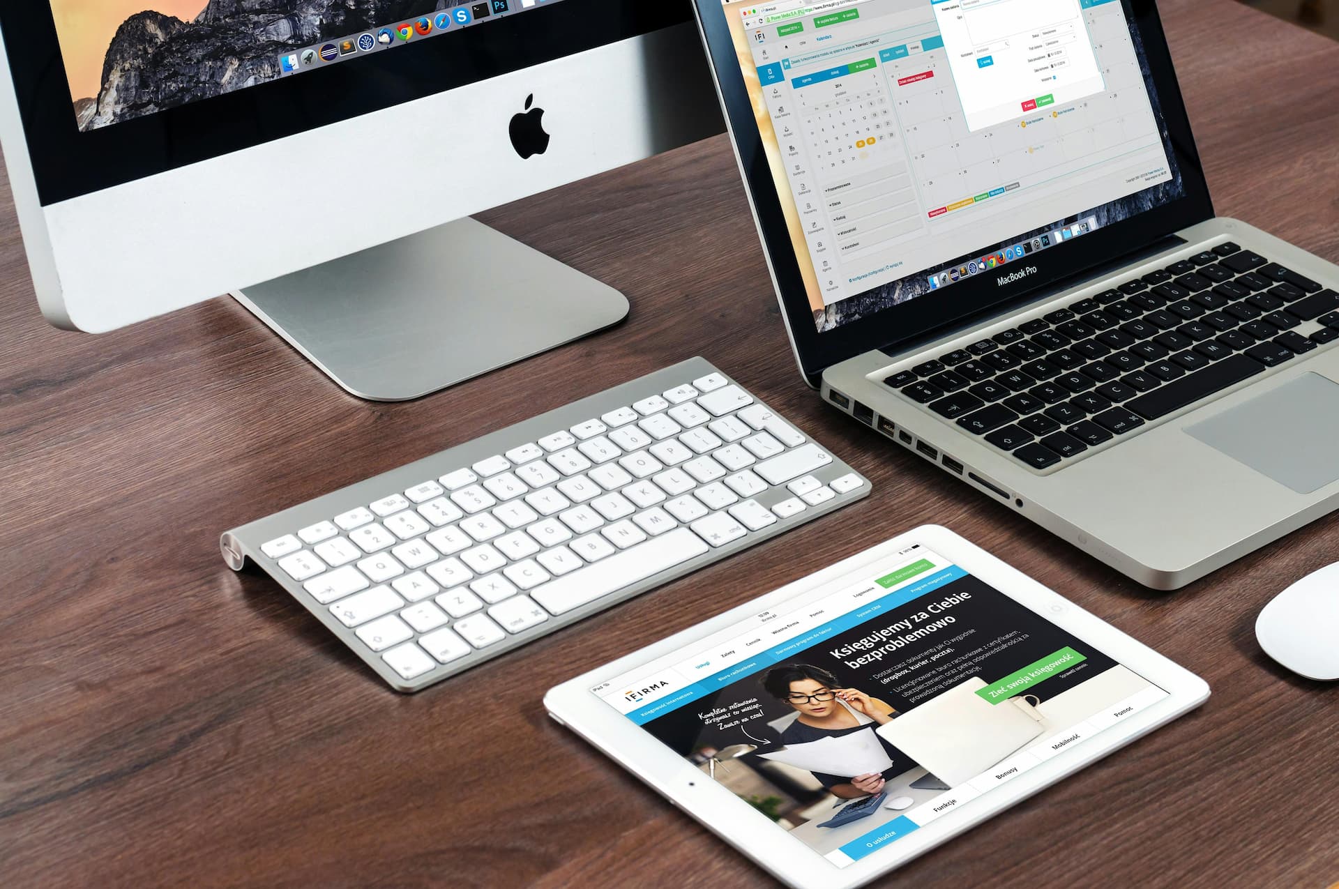 Laptop on desk showing a website.